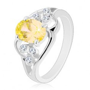 Prsten stříbrné barvy, velký žlutý oválný zirkon, asymetrické linie R30.26