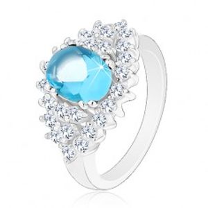 Třpytivý prsten se světle modrým oválným zirkonem, čirá zirkonová obruba G14.31